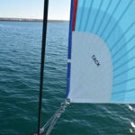 Top down furling asymmetric spinnaker